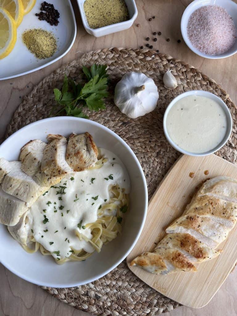 tender lemon pepper chicken with fettuccine Alfredo