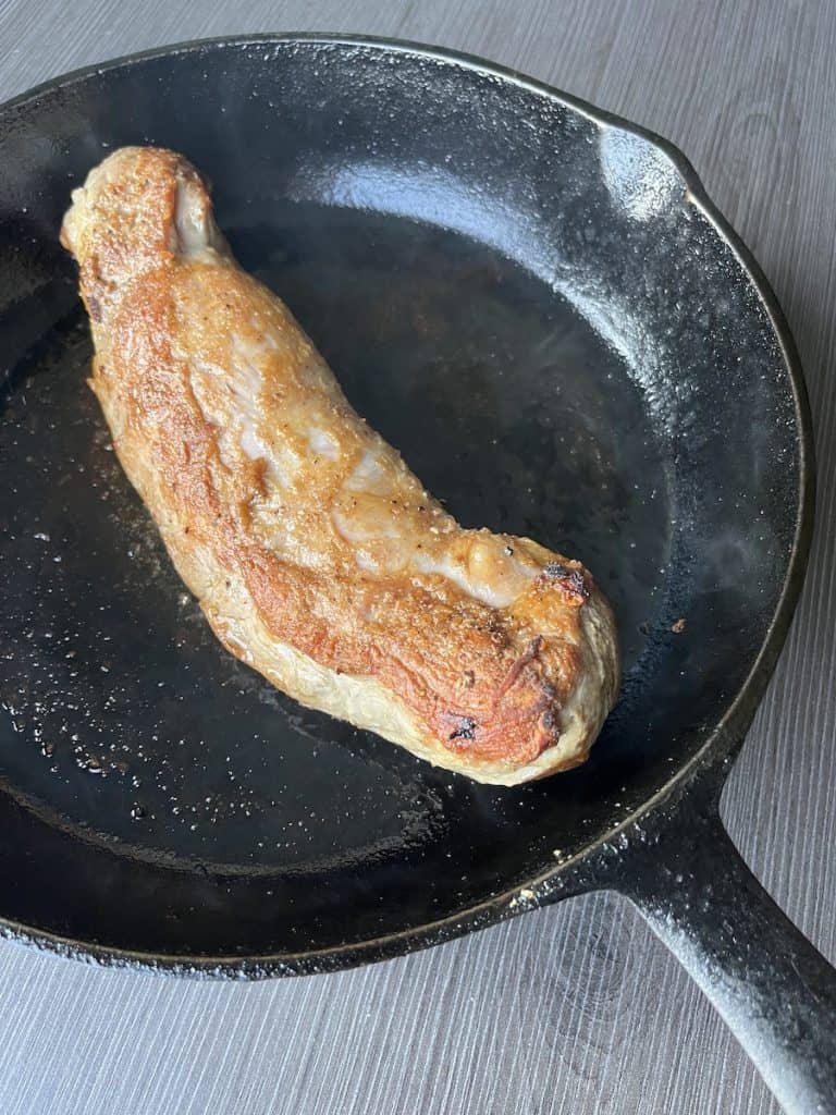 pork tenderloin seared in cast iron skillet