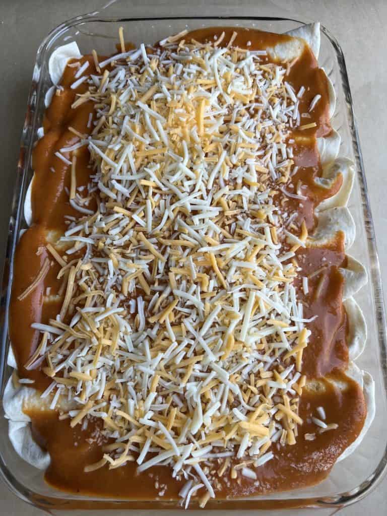 enchiladas with red sauce and shredded cheese