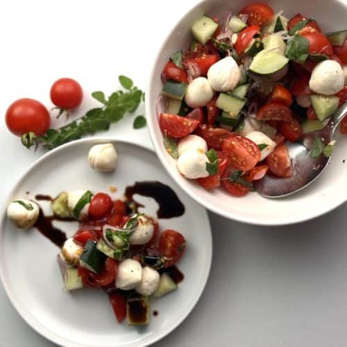 tomato cucumber mozzarella salad on a plate