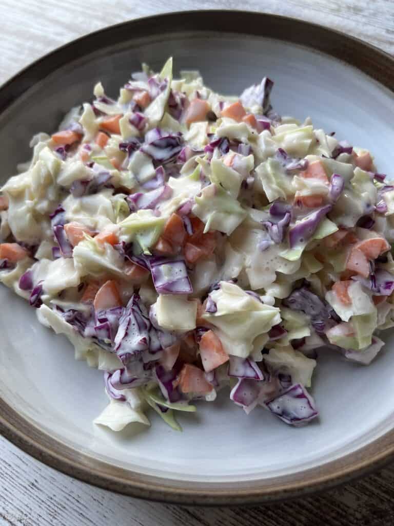 creamy coleslaw with red cabbage in bowl