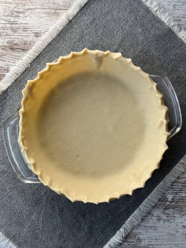 pie crust in a glass pie dish