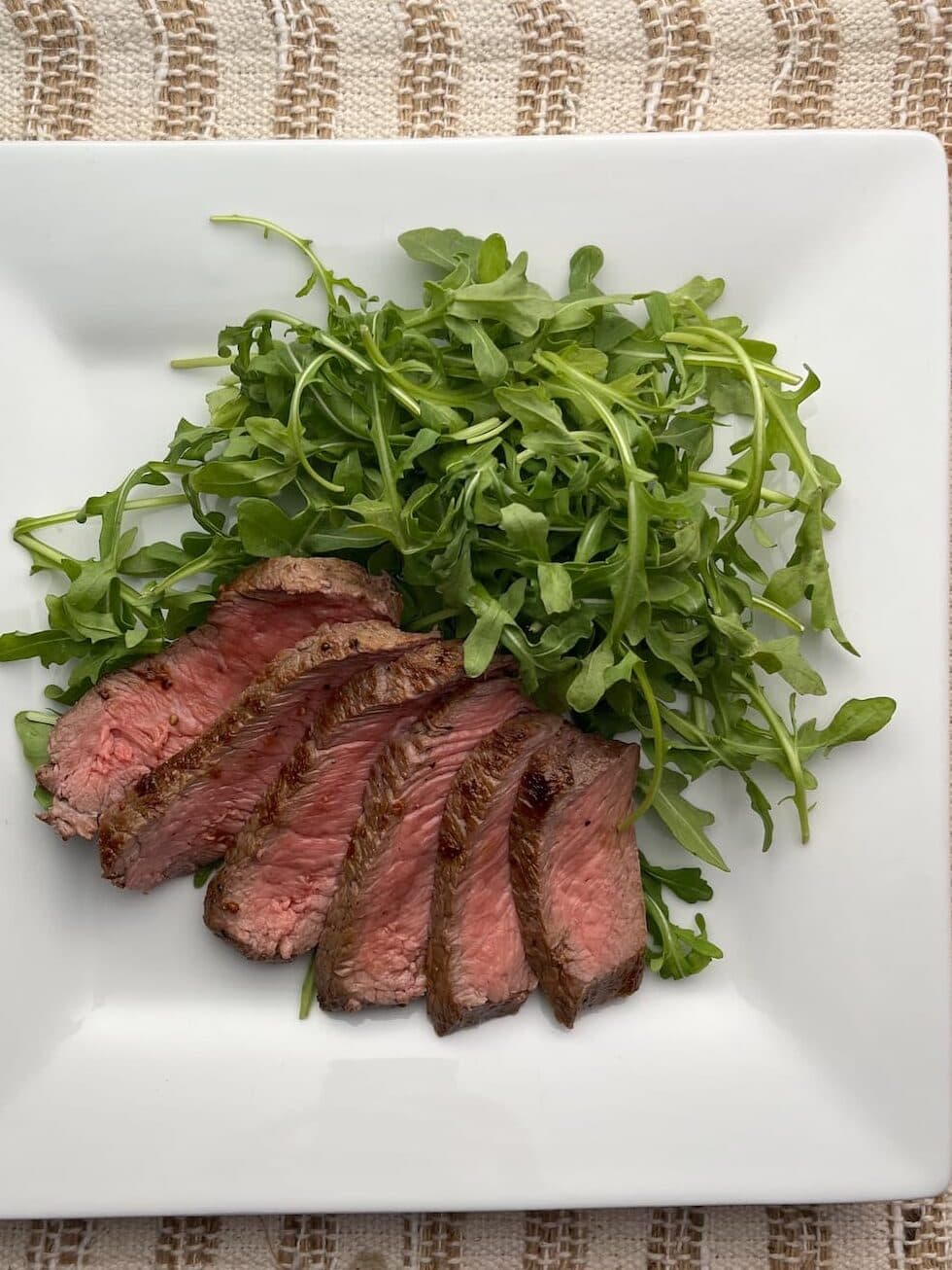 arugula steak salad on a plate