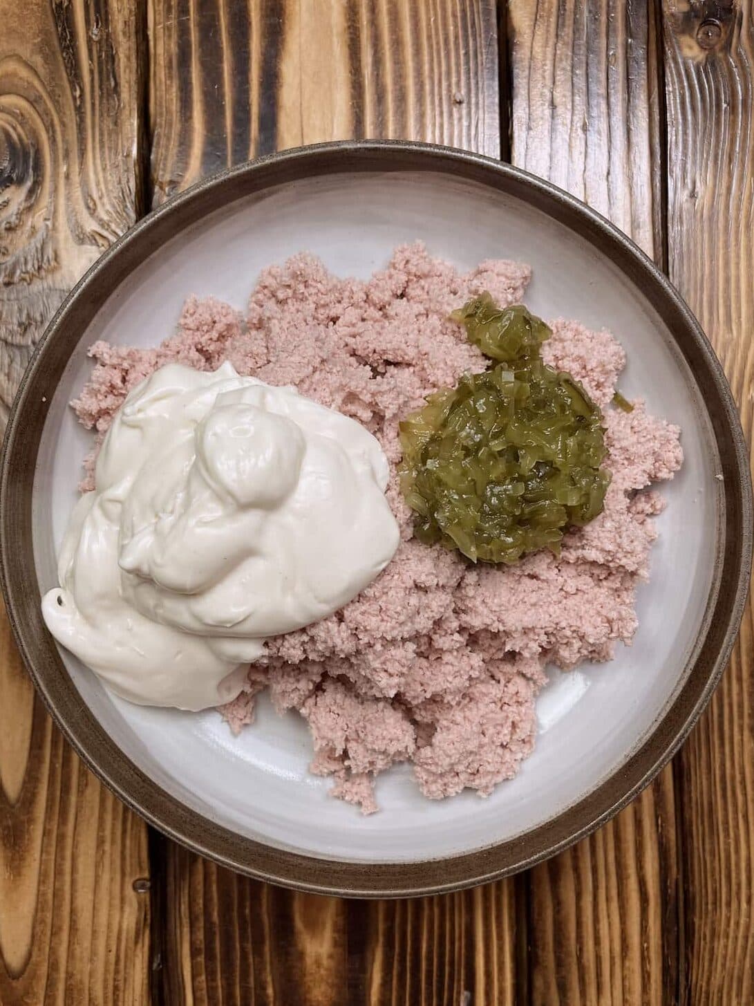 ground bologna in a bowl with relish and miracle whip