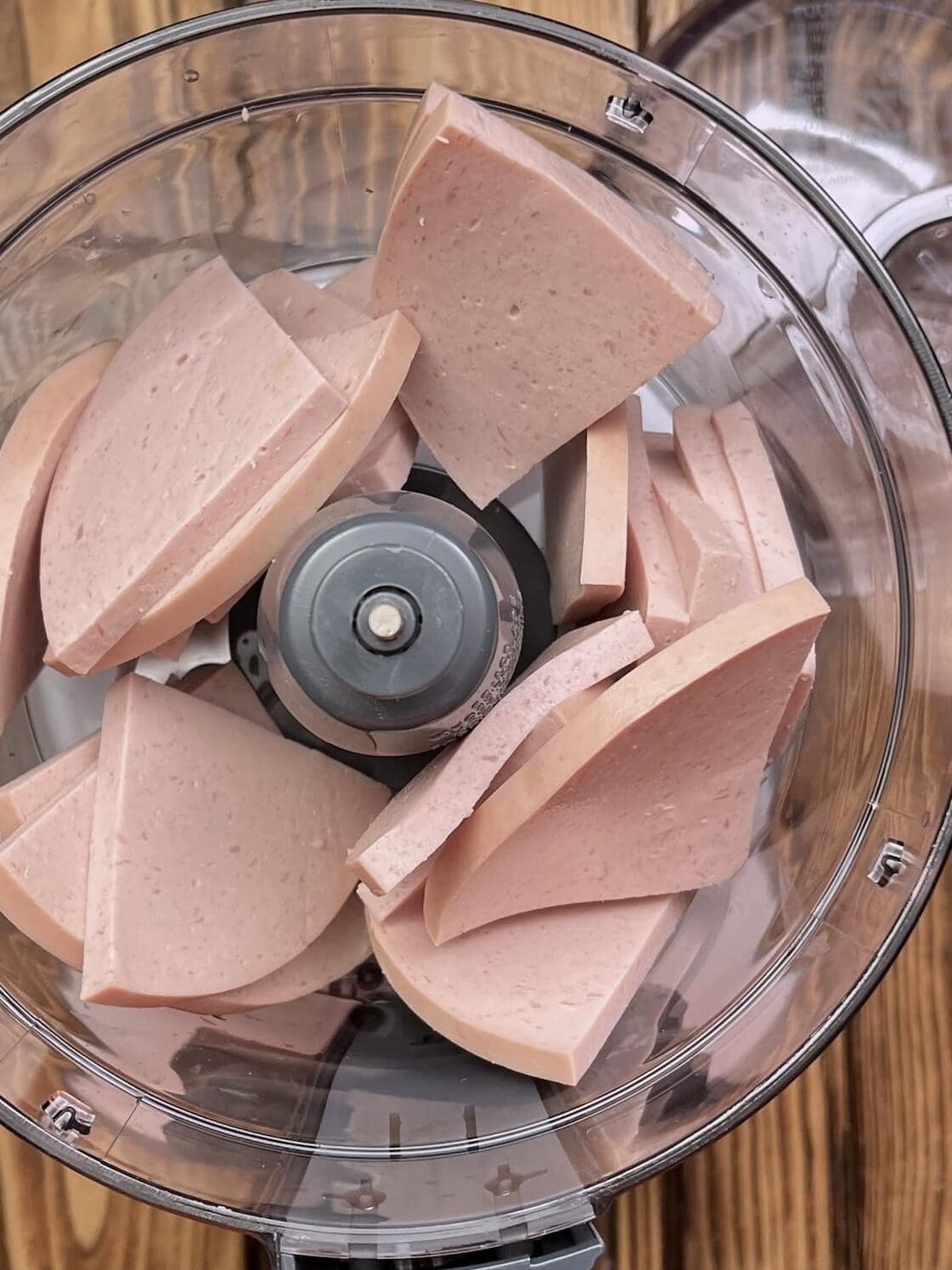 quartered bologna in a food processor