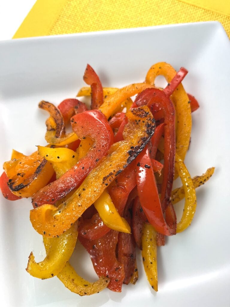 sauteed bell peppers with lemon pepper seasoning on a plate