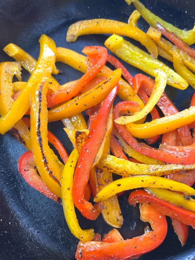 sauteed bell peppers with lemon pepper seasoning in skillet