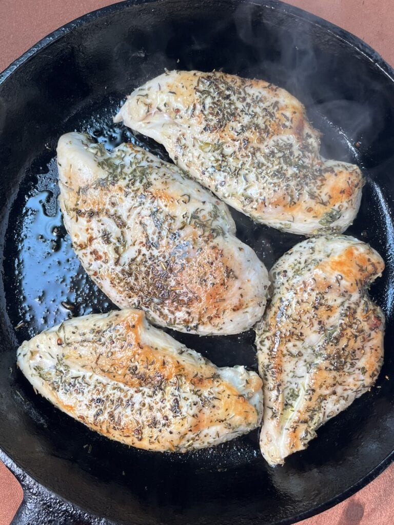 fully cooked seasoned chicken in a skillet