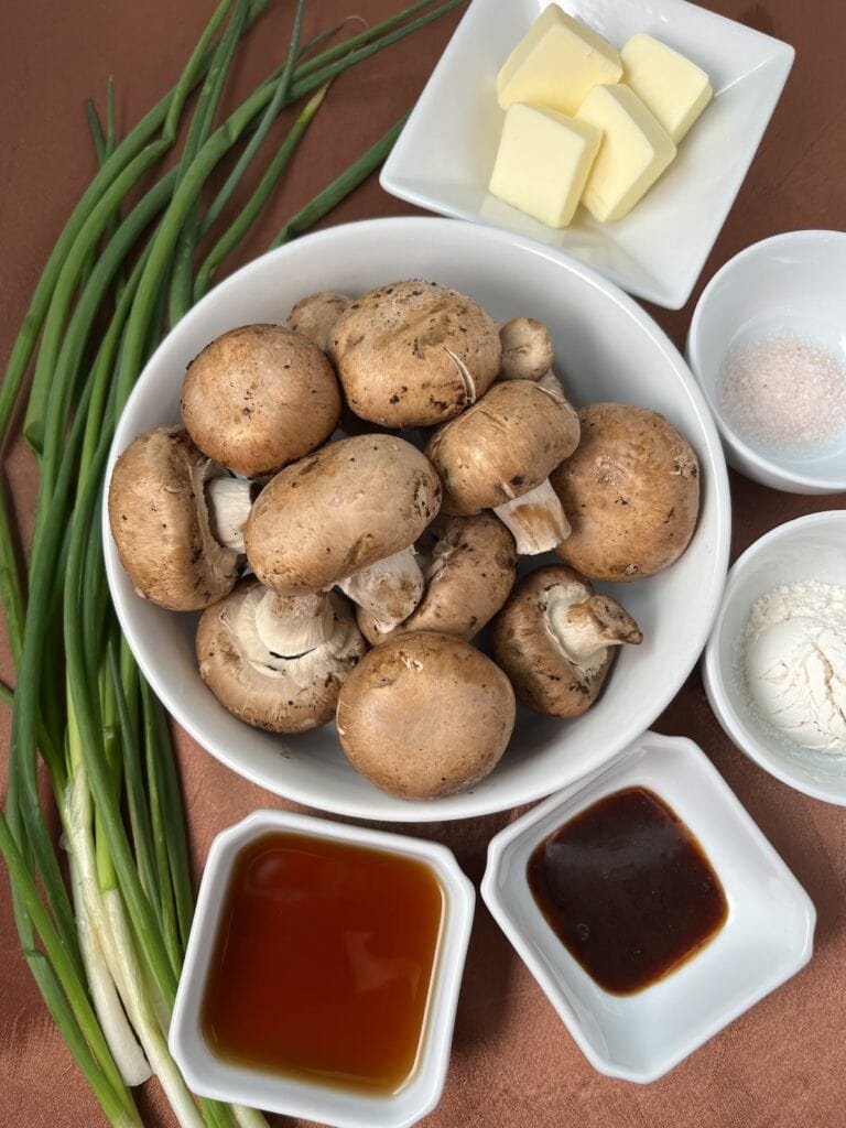 mushrooms in a bowl, green onions, butter, salt, flour marsala and beef paste in bowls