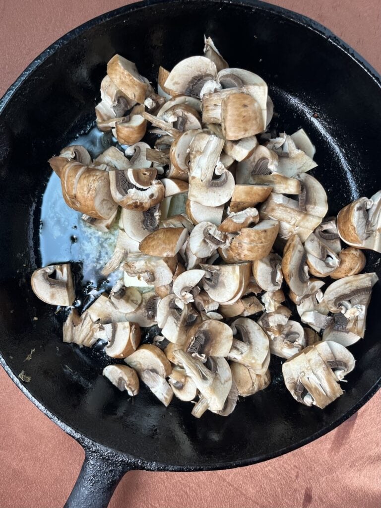 raw mushrooms in a skillet